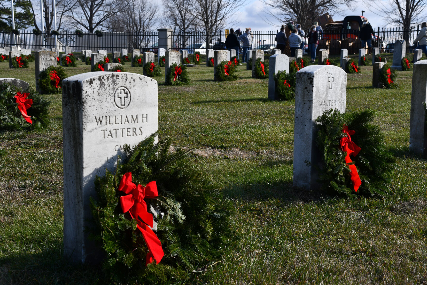 Wreaths adorn gravestones